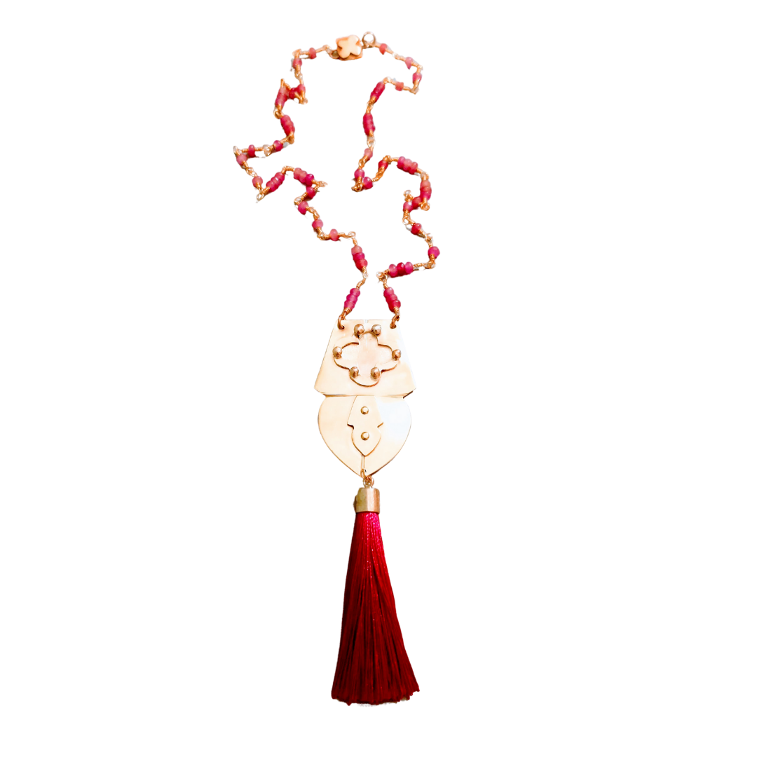 Pink glass and brass pendant necklace with fuchsia tassel and Quatrefoil SoufiiArte Hidden Signature Clasp from the Marrakesh Collection.