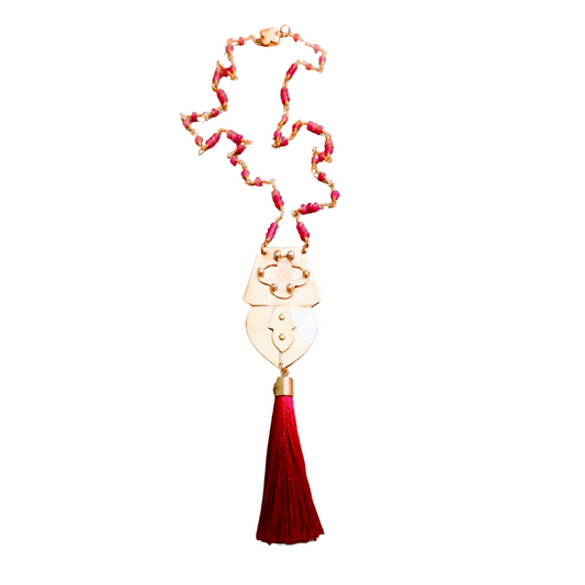 Pink glass and brass pendant necklace with fuchsia tassel and Quatrefoil SoufiiArte Hidden Signature Clasp from the Marrakesh Collection.