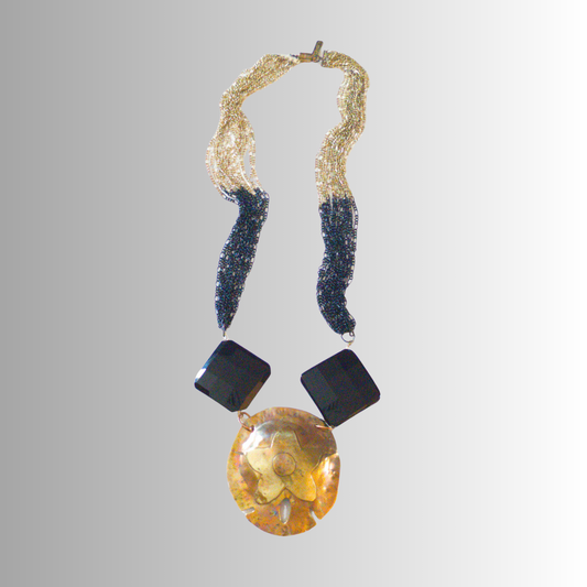 Guiding star sand dollar necklace in patina brass with black faceted onyx and layered black-gold multi-chains, handmade by SOUFiiARTe.