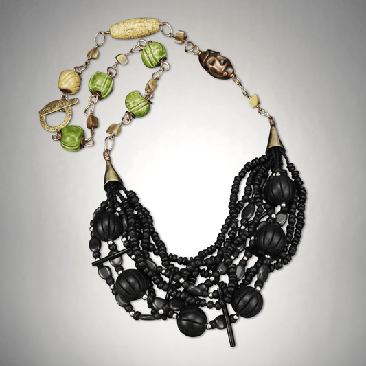 34-inch brass chain necklace with gray quartz, spiky black coral sticks, aplpe green pottery beads, and wood accents