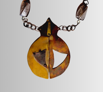 Necklace with a unique pendant on a light gray background